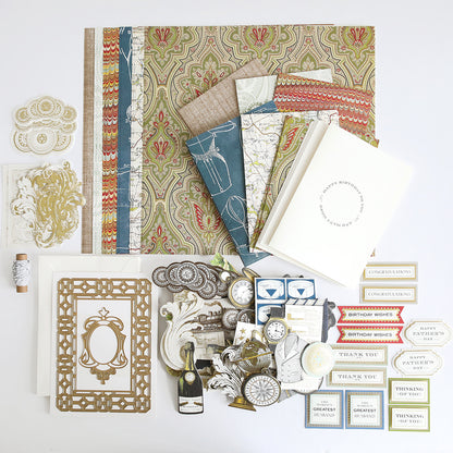 The All About Him Papercrafting Kit with Dies features patterned papers, blank cards, frames, tags, labels, and vintage embellishments for card making or scrapbooking—beautifully arranged on a white surface.