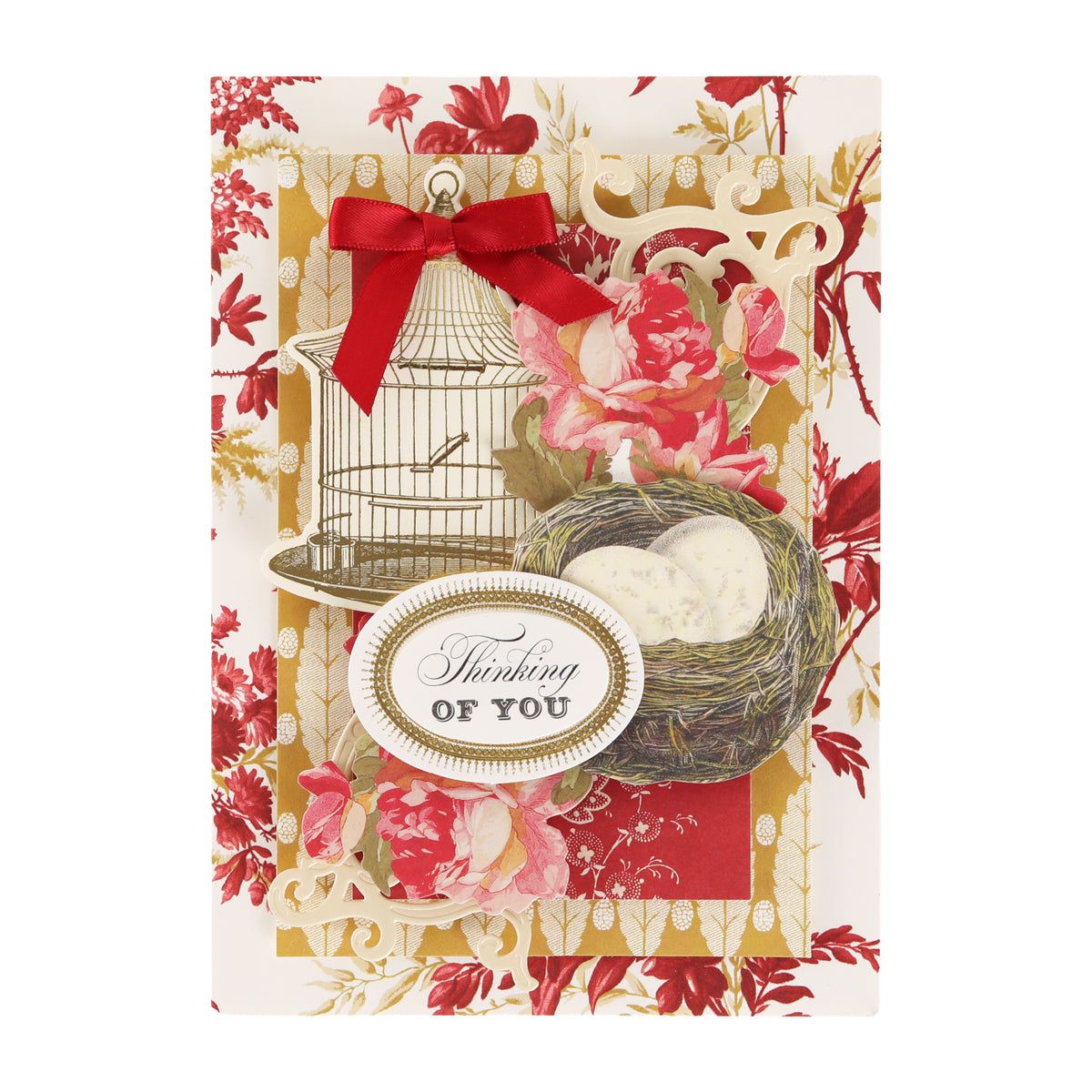Sure! Here’s a revised version using your product data: This greeting card features a red floral background, a birdcage illustration, a vibrant red bow, and a bird’s nest with eggs, accented by an ornate “Thinking of You” sign—beautifully crafted with elements and dies from the Fleur Rouge Papercrafting Kit with Dies—perfect for vintage-style papercrafting enthusiasts.