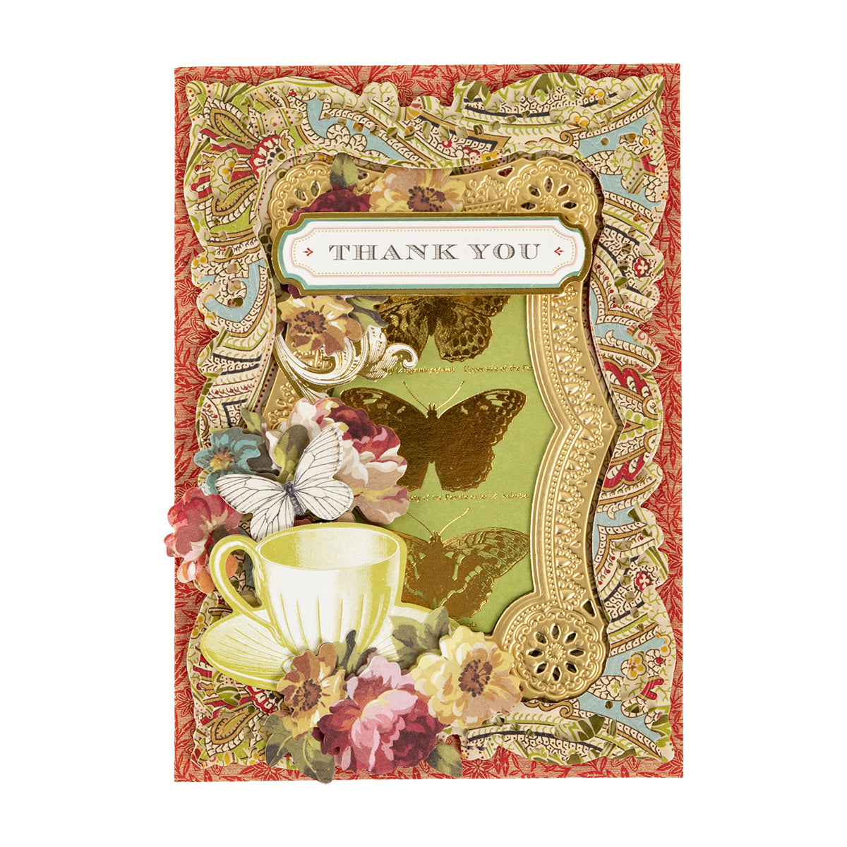 Handmade greeting card featuring an ornate gold frame, teacup, flowers, and butterflies on a paisley background, created with a Haven Papercrafting Kit with Dies.