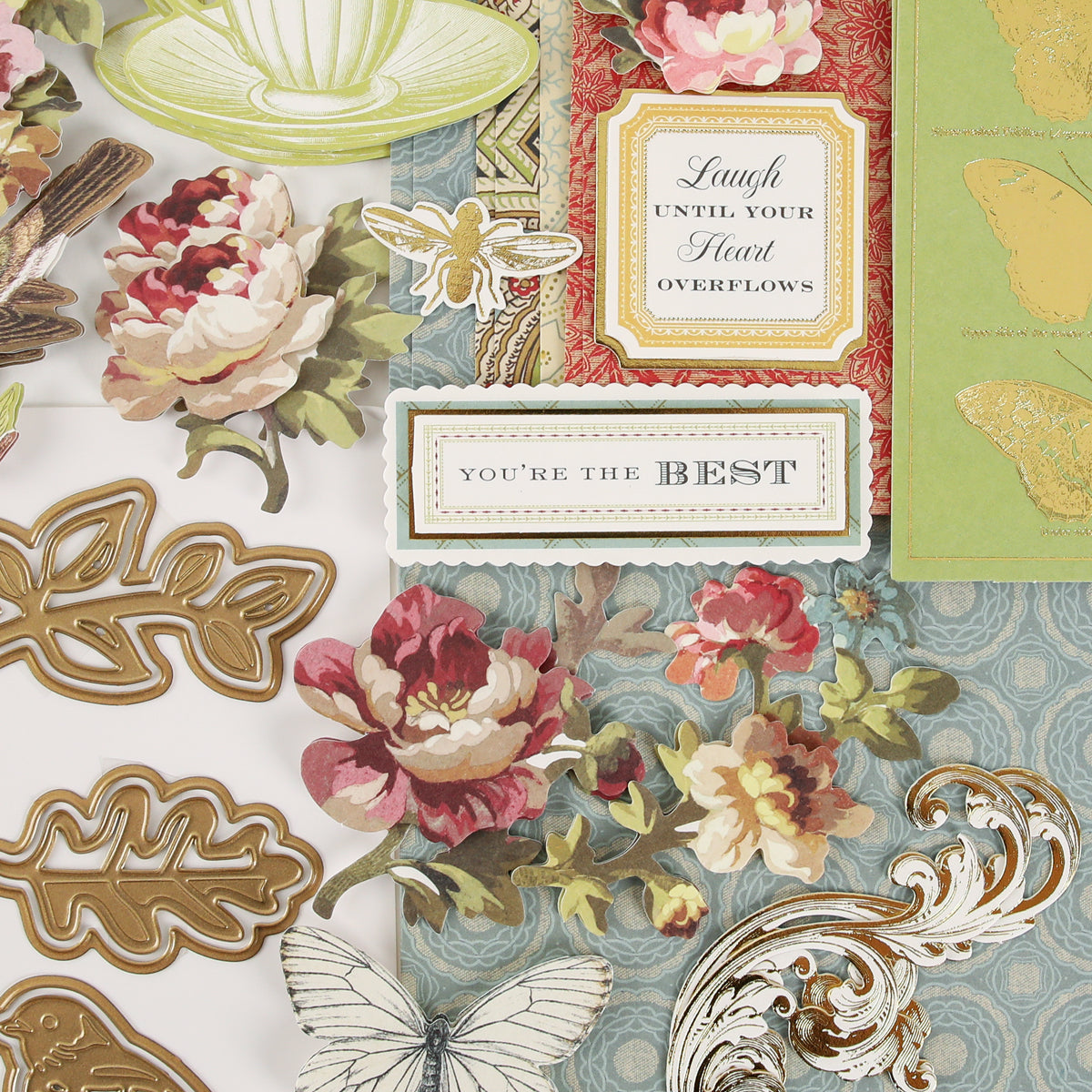 Haven Papercrafting Kit with Dies including floral and butterfly cutouts, ornate metal dies, and rectangular labels reading “Laugh until your heart overflows” and “You’re the best” for vintage cards.