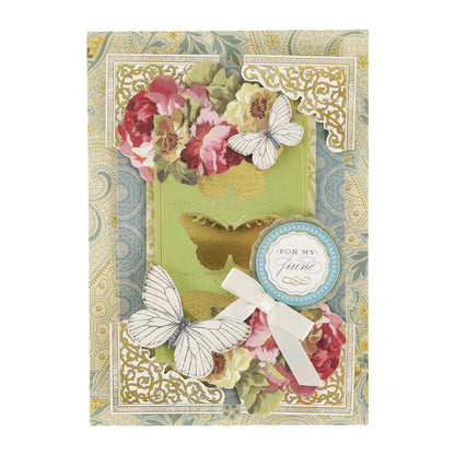 Handmade vintage greeting card created with the Haven Papercrafting Kit with Dies, featuring floral patterns, two white butterfly cutouts, a gold butterfly silhouette, and a “For my friend” ribbon tag.