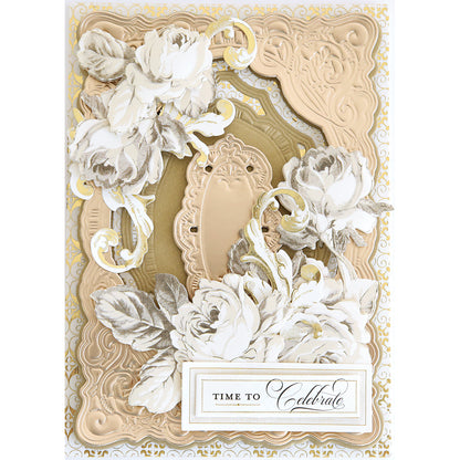 This ornate greeting card features layered beige and gold frames made with the Scroll Corner Concentric Frames 3D Die Set, delicate white flowers, and a "Time to Celebrate" label for an elegant, intricate look inspired by decorative dies.