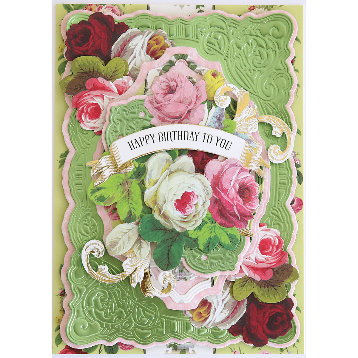 A decorative card featuring embossed green and pink layers, floral rose motifs, ornate scrollwork, and a "Happy Birthday To You" banner, beautifully crafted using the Scroll Corner Concentric Frames 3D Die Set.