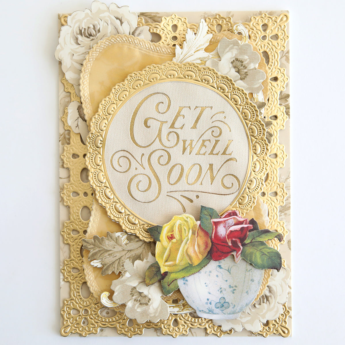 Elegant "Get Well Soon" handmade card, featuring gold accents, floral decor, and yellow, red, and white roses at the bottom. Crafted on Fabric Card Layers Neutral for a refined look.
