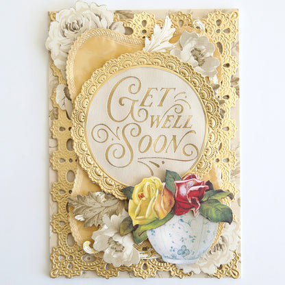 Elegant "Get Well Soon" handmade card, featuring gold accents, floral decor, and yellow, red, and white roses at the bottom. Crafted on Fabric Card Layers Neutral for a refined look.