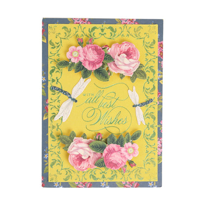 Bright Fabric Card Layers featuring the sentiment “With all best wishes,” adorned with pink flowers, green leaves, and two dragonflies on a yellow, floral-patterned background—an ideal inspiration for card making or scrapbooking projects.