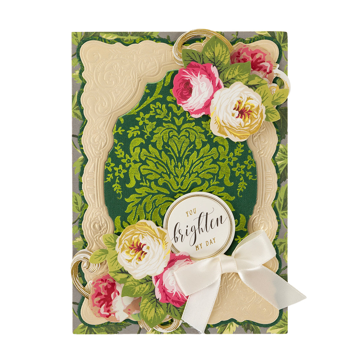 Dark Fabric Card Layers features a green and gold ornate background, cream frame, pink and white flowers, gold accents, and a white bow with “You brighten my day.”.