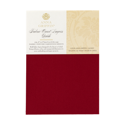 A package of Dark Fabric Card Layers in dark red for card making, with product info on the label and a 5″ x 7″ fabric sheet sample below.