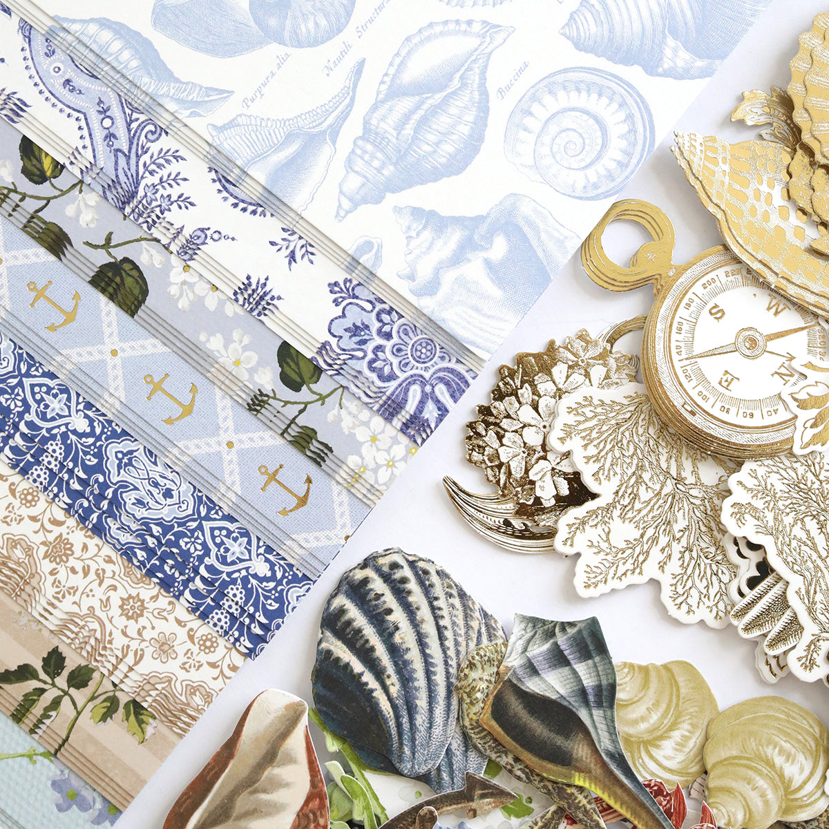 Summer House Cardstock and Embellishments features nautical and seashell patterned papers, vintage die cuts of shells, foliage, and pocket watches—ideal for coastal scrapbooking or adding nautical touches to your projects.