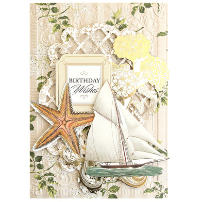 The Summer House Cardstock and Embellishments set features "Birthday Wishes" text with a sailboat, starfish, yellow flowers, and ornate patterns—ideal for coastal scrapbooking or nautical-themed projects.