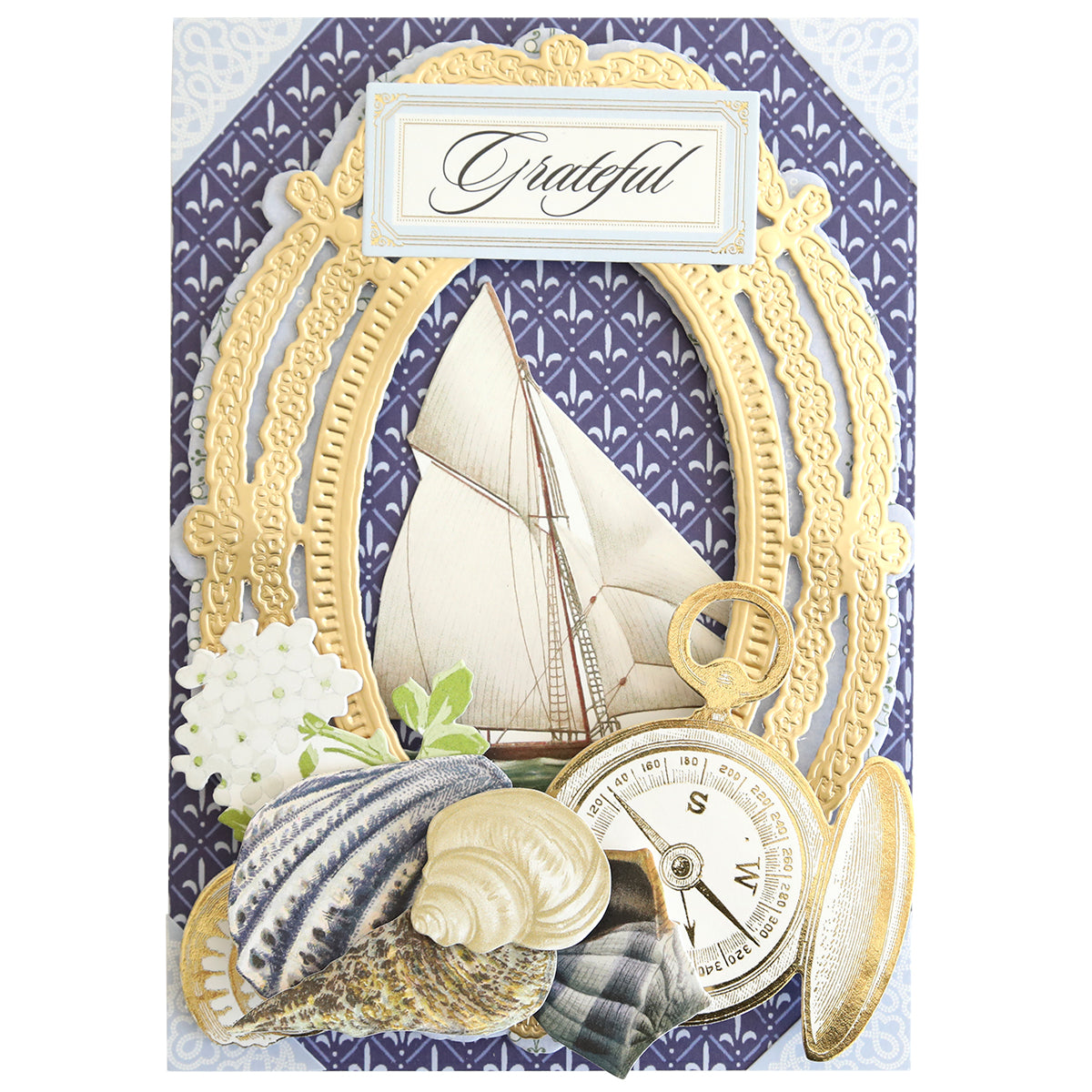 The Summer House Cardstock and Embellishments set features a "Grateful" card with a sailboat, compass, seashells, flowers, and gold borders on navy—ideal for coastal scrapbooking or nautically-themed projects.