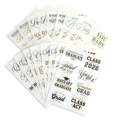 Marvelous Milestones Rub On Sentiments: A set of decorative cards with gold and black congratulatory messages for graduates and new babies, perfect for handmade cards or memory-keeping projects, shown fanned out.