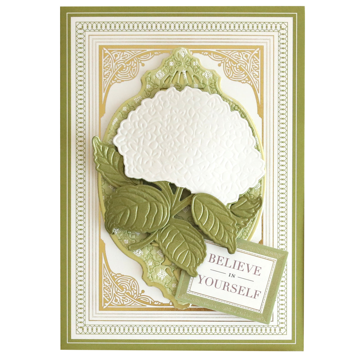 A decorative card on Luxury Ivory Soft Matte 250gsm Cardstock features an embossed white flower with green leaves and border, plus a “BELIEVE IN YOURSELF” sign in the lower right corner.