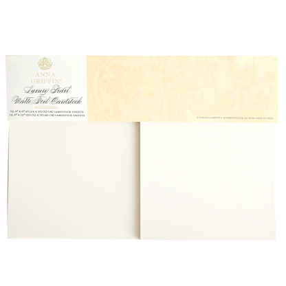 An open pack of Luxury Ivory Soft Matte 250gsm Cardstock features bisque-colored sheets with a matte finish and a decorative packaging label in the top left corner.