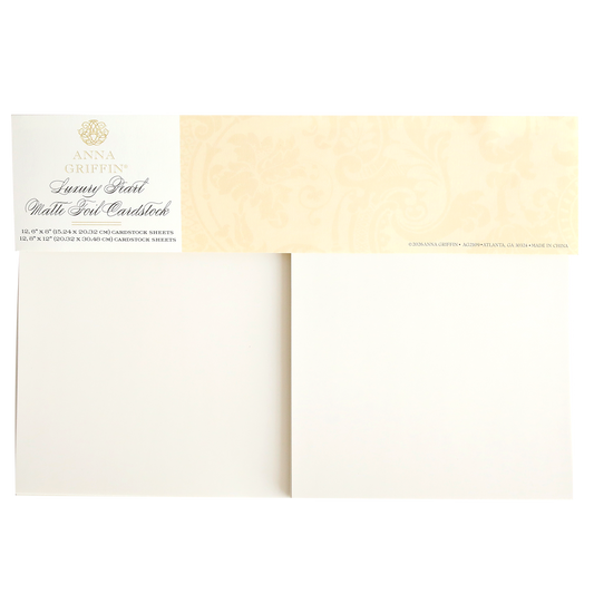 The Luxury Pearl Matte 250gsm Cardstock pack opens to reveal two elegant cardstock sheets, each featuring a decorative label in the top left corner.
