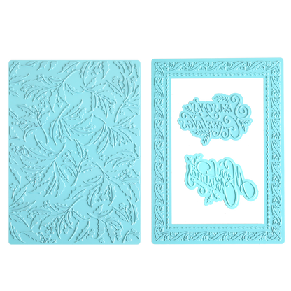 Two light blue silicone embossing mats—one featuring a leaf pattern, the other with a bordered frame and two mirrored decorative text designs in the center—perfect for adding elegant texture to your holiday card making or pairing with the Gilded Christmas Hot Foil Plate Bundle for a gilded finish.