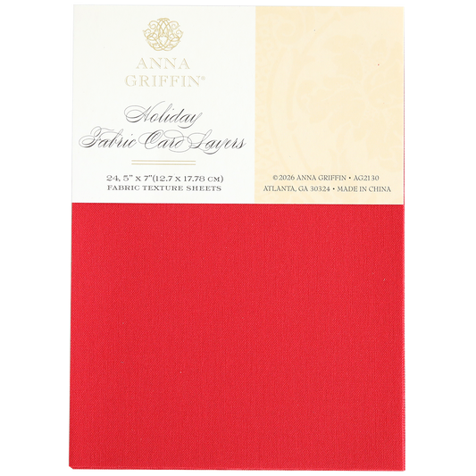 A package labeled "Holiday Fabric Card Layers" showcases a rich red fabric-texture sheet on the front, making it ideal for creating luxurious Christmas cards with elegant fabric cardstock.