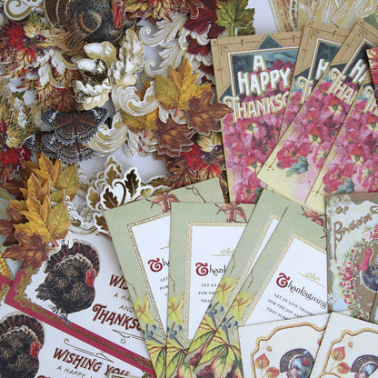 The Fall Thanksgiving Postcards and Embellishments, featuring turkey motifs, autumn leaves, and floral designs, are displayed in a vibrant, overlapping arrangement.