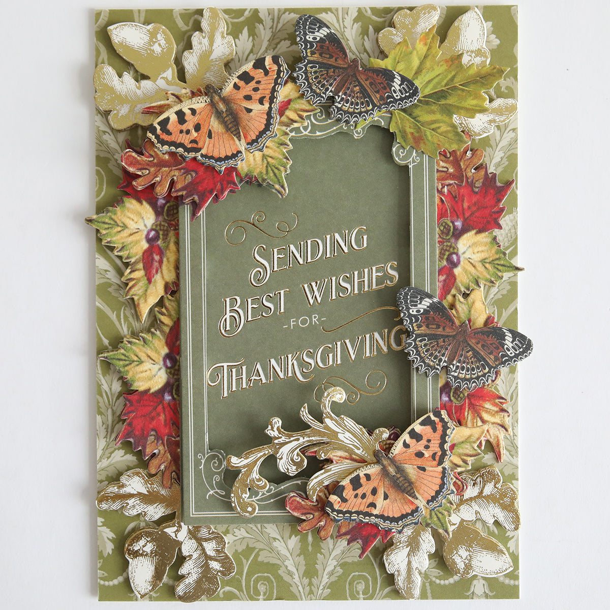 The Fall Thanksgiving Postcards and Embellishments feature butterflies, autumn leaves, and acorns framing the message “Sending Best Wishes for Thanksgiving” on a green background—perfect for anyone who loves autumn paper crafts or wants to send unique Thanksgiving postcards.