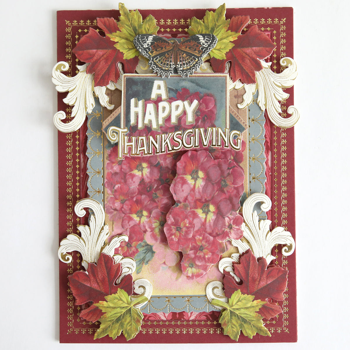 Add a festive touch to your collection with Fall Thanksgiving Postcards and Embellishments—these decorative cards feature red and pink flowers, ornate leaves, gold detailing, and a butterfly alongside the bold “A Happy Thanksgiving” greeting, making them perfect for anyone who loves fall designs or collects classic Thanksgiving postcards.