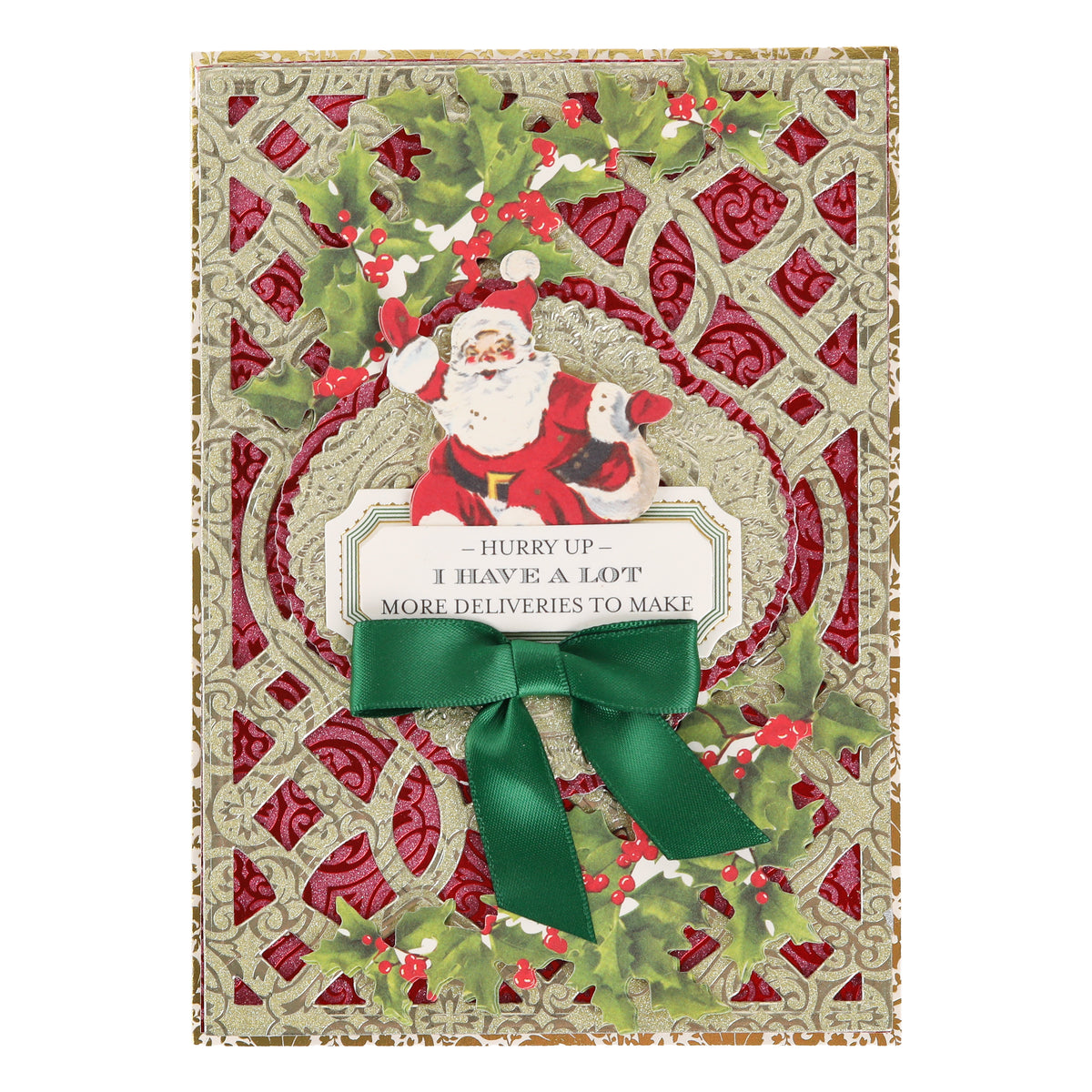 Create festive Christmas cards using Holiday Glitter Foil Pattern 12x12 Cardstock, featuring a raised Santa illustration, holly accents, a green bow, and a gold and red background. The card includes the playful message: “Hurry up - I have a lot more deliveries to make.” This charming design is ideal for lovers of Christmas paper crafts.