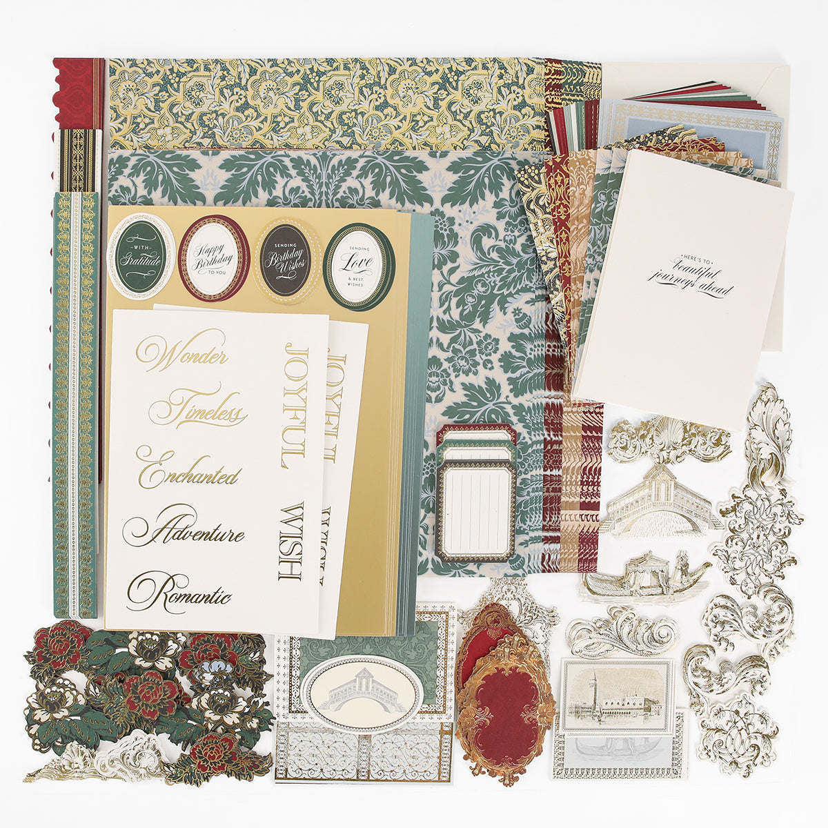 The Venetian Ultimate Paper Crafting Collection includes patterned papers, ornate stickers, cardstock, greeting cards, die-cuts, and labels—all arranged on a white surface.