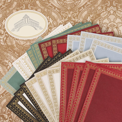 Venetian Ultimate Paper Crafting Collection: decorative certificate papers and envelopes with gold borders, displayed on a patterned brown backdrop featuring an oval architectural illustration.