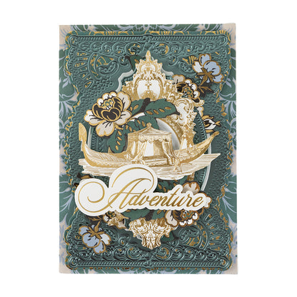 A decorative card from the Venetian Ultimate Paper Crafting Collection, with gold, florals, an ornate gondola, and “Adventure” in elegant script at the center.