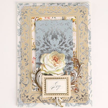 Elegant card created with Venetian Gilded Frame Pattern Foil Plates, featuring layered florals, white rose, hot foil accents, and a small “joy” card in the center.