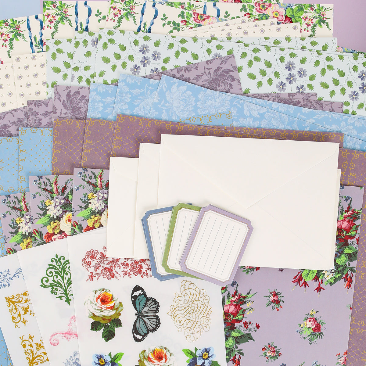Introduce creativity into your next project or craft class with the Anna Griffin | Create Fall 2026 collection—a beautifully arranged set of decorative floral patterned papers, blank envelopes, label cards, and stickers adorned with elegant flowers and a butterfly. Perfect for sharing inspiration within your creative community.