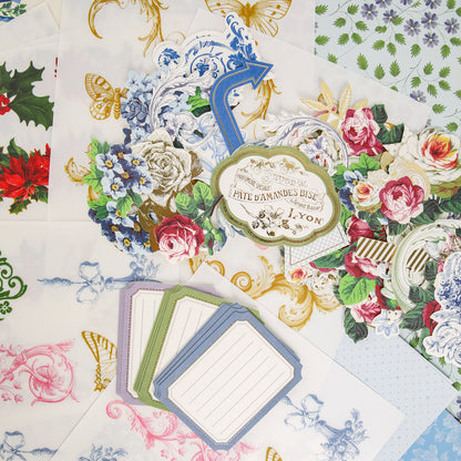 Assorted decorative floral and patterned stationery, featuring blank lined cards, ornate frames, butterflies, and colorful flowers from Anna Griffin | Create Fall 2026, are arranged on a white surface—ideal inspiration for creative communities or anyone looking to join craft classes this fall.