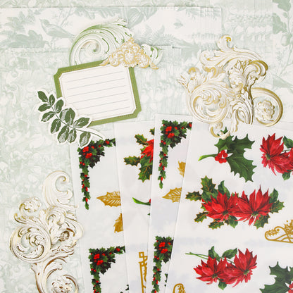 Paper sheets from Anna Griffin | Create Fall 2026, featuring festive floral and holly designs with ornate gold embellishments and a blank label card, are beautifully arranged on a pale green patterned background—ideal inspiration for crafters or upcoming classes as you plan creative projects for the season.