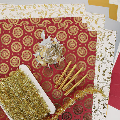 Anna Griffin | Create Fall 2026—featuring an array of patterned and solid-colored paper sheets, a gold tinsel garland, gold pens, and a decorative gold flower—offers the perfect inspiration for craft classes or to spark creativity within your creative community.