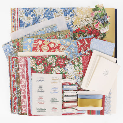 Anna Griffin | Create Fall 2026 features an elegant array of floral patterned papers, envelopes, printed labels, decorative cutouts, ribbons, and blank cards artfully arranged on a white background—perfect for heritage crafts or inspiring your next project in crafting classes.