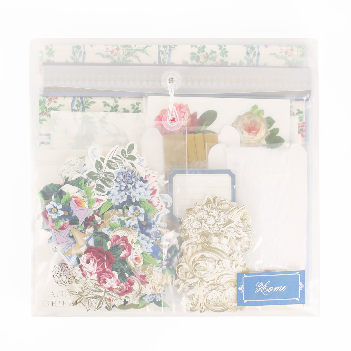 A clear plastic pouch filled with floral stickers, ornate paper cutouts, envelopes, and a blue label that reads “Home”—the Anna Griffin | Create Fall 2026 kit is perfect for heritage crafts or as an inspiring addition to your crafting classes.