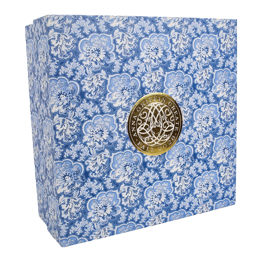 Blue and white floral patterned box with a gold circular emblem in the center displaying “Anna Griffin | Create Fall 2026.” Perfect for anyone looking to join a creative community or enhance their skills through online craft classes, this elegantly designed box inspires you to create your own Fall 2026 masterpieces.