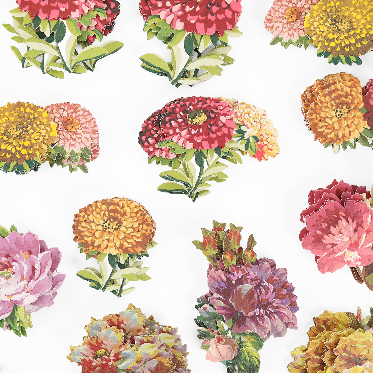 Vivid red, yellow, orange, and pink blooms decorate the crisp white background of Fall Flower Embellishments with colorful cut-out floral designs.