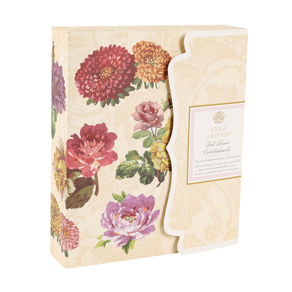 A cream box of Fall Flower Embellishments with gold foil, colorful flowers, and floral accents in a scalloped-edge design.
