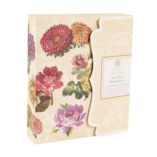 A cream box of Fall Flower Embellishments with gold foil, colorful flowers, and floral accents in a scalloped-edge design.