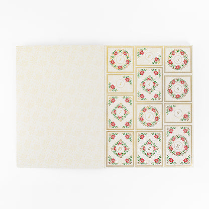 The Christmas Grace Advent Calendar features twelve numbered compartments with festive wreath designs—an ideal holiday project for paper crafting enthusiasts.