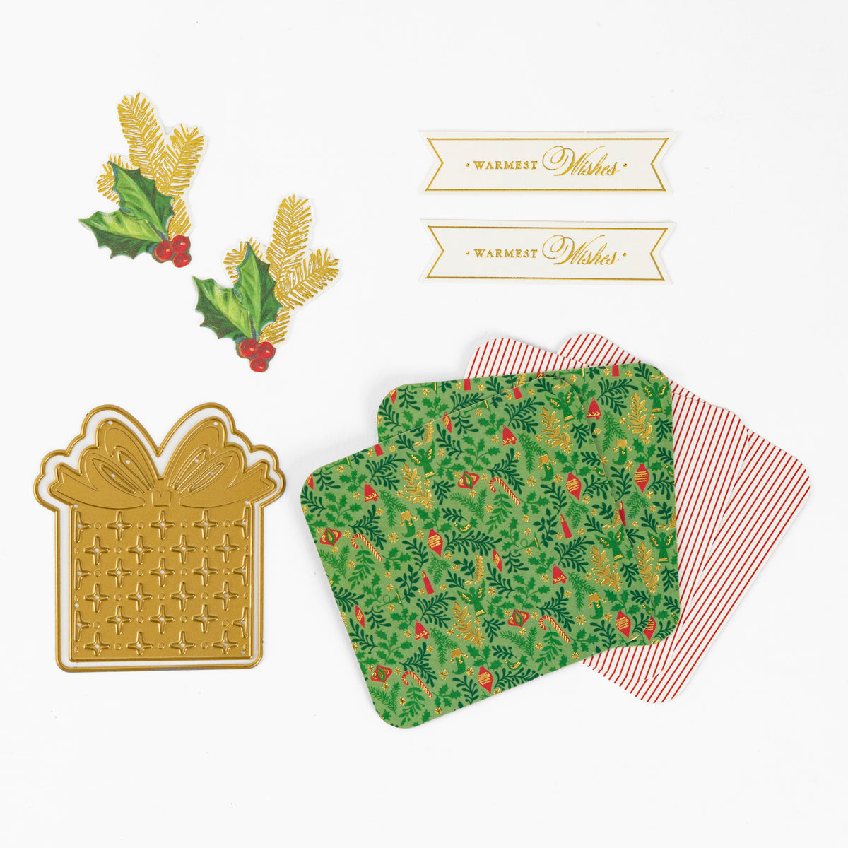 Christmas Grace Advent Calendar: gold gift box die cut, holly & pine sprigs, “Warmest Wishes” banners, and festive papers—perfect for holiday projects or Advent paper crafting.