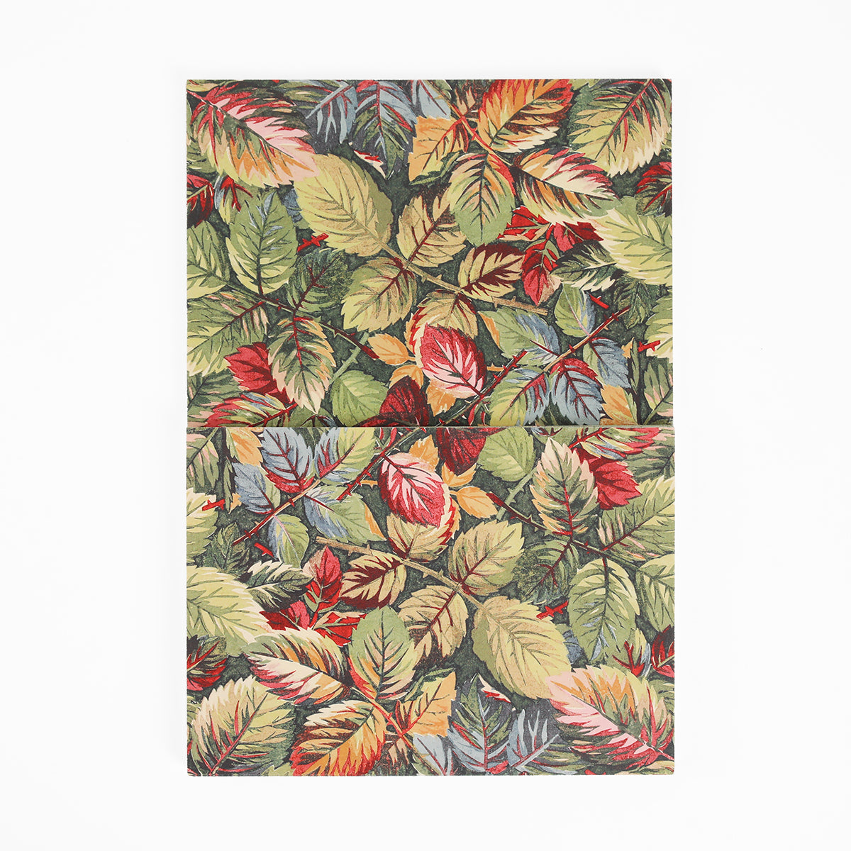 A rectangular object covered in a repeating pattern of multicolored autumn leaves, split into two aligned sections on a white background, these Sienna Folded Cards and Layers are perfect for cardmaking or creating customized 5″ x 7″ cards.