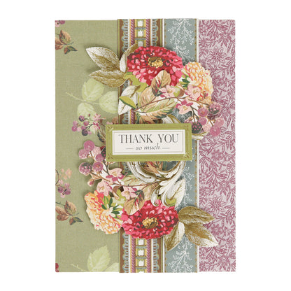 The Sienna Folded Cards and Layers set is ideal for cardmaking projects, featuring a 5″ x 7″ floral thank you card adorned with red and yellow flowers, gold leaves, and patterned backgrounds. The center text reads, “Thank you so much.”.