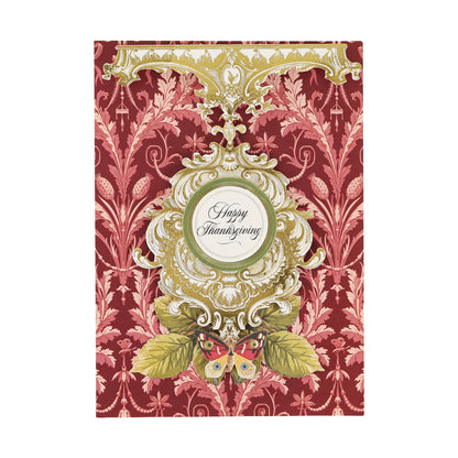 An elegant “Happy Thanksgiving” card featuring decorative gold scrollwork, a butterfly, green leaves, and a red patterned background, tastefully enhanced with Gold Foil Flourish Stickers and other metallic sticker accents for an added touch of sophistication.