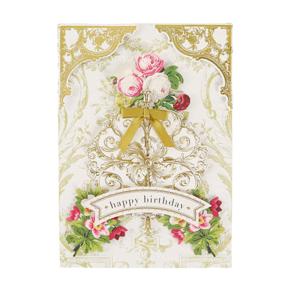 A decorative birthday card featuring gold accents, floral designs, a gold ribbon, and “happy birthday” on the front pairs beautifully with Gold Foil Flourish Stickers for an added touch of elegance.