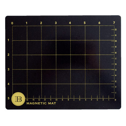 The Empress Small and Large Magnet Mats are black rectangular mats with a yellow grid (numbered 0–6 horizontally, 0–11 vertically) labeled “JB Magnetic Mat” in the corner—ideal die-cutting mats for precise, versatile crafting.