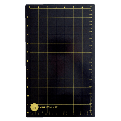 The Empress Small and Large Magnet Mats are rectangular black mats with a yellow grid and numbered edges. A circular "B Magnetic Mat" label is in the lower left corner. Ideal as magnet or die-cutting mats for accurate crafting.