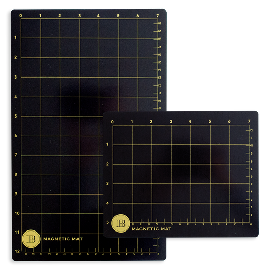 The Empress Small and Large Magnet Mats include two black mats with gold grid lines and numbers—one large, one small—each labeled "IB Magnetic Mat" in the bottom left corner, ideal for use as magnet or die-cutting mats.