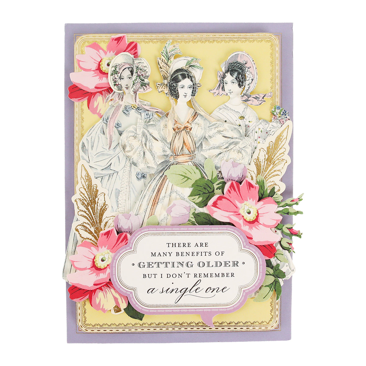 Three women, styled as Victorian ladies in vintage clothing, stand among colorful flowers with a sign reading, “There are many benefits of getting older but I don’t remember a single one.” The charming scene resembles the layered die cuts featured in the Paper Doll Card Toppers Kit, perfect for creating elegant greeting cards.