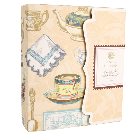 Box featuring vintage tea set illustrations and labeled “Favorite Tea Embellishments 120 Count” on a scalloped flap, set on a cream-colored background with tea-themed artwork—ideal for adding handmade card embellishments or antique-style tea stickers to your creative projects.
